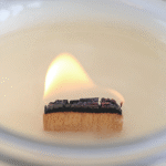 lit wood candle wick
